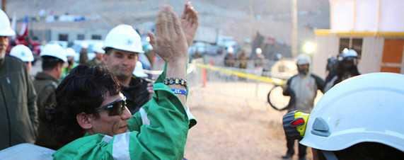 Getty Images Claudio Yanez, 34 years old, was taken away on a stretcher after becoming the eighth miner rescued Wednesday at the San Jose mine near Copiapo, Chile.