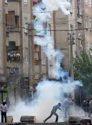Kurdish PKK supporters clash with Turkish riot police in Diyarbakir.