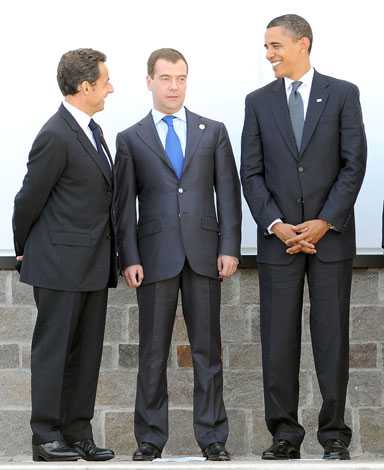 Russia's Dmitry Medvedev (center) flanked by French and American presidents during G20 meeting last June. Photolur