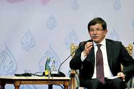 Turkish Foreign Minister Ahmet Davutoglu talks during a book signing in Doha on Oct. 19.