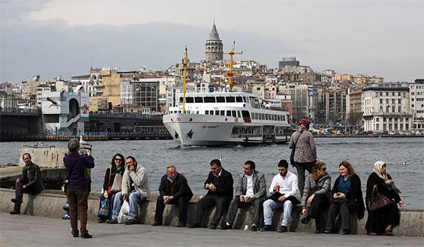 FAMILIAR RITE: A passenger ferry arrives at Eminonu pier in the European side of Istanbul.