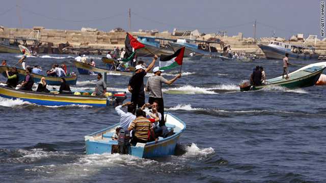 Palestinians rally Monday off the coast of Gaza City to mark the first anniversary of a deadly Israeli raid on a Turkish flotilla