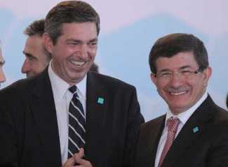 Greek Foreign minister Stavros Lambrinidis (L) and Turkish Foreign Minister Ahmet Davutoglu chat before the fourth meeting of the International Contact Group for Libya, in Istanbul, Turkey on 15 July 2011.