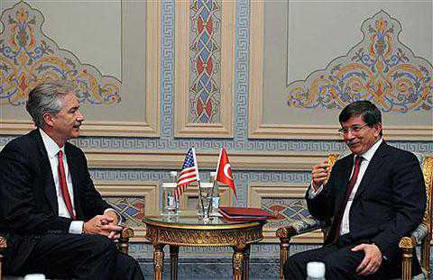 Photo: AP  Turkish Foreign Minister Ahmet Davutoglu (R) and US Deputy Secretary of State William Burns speak after the Istanbul Conference for Afghanistan in Istanbul, Turkey, November 2011. (file photo)