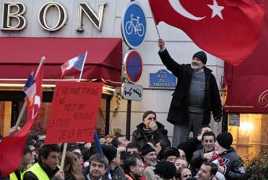 Turkey makes peace with France in wait-and-see game