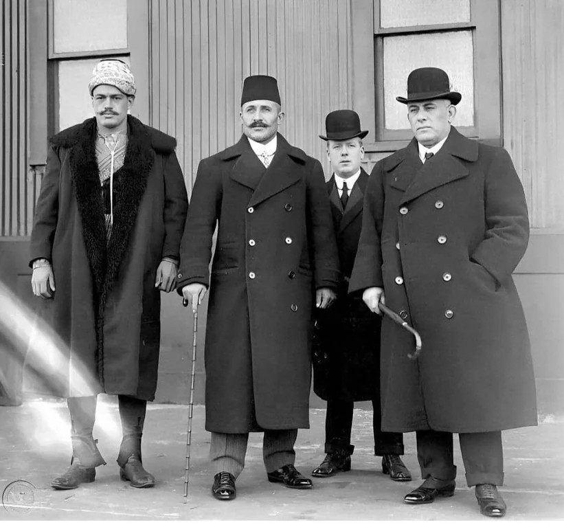 Two Turkish wrestlers and a former Greek wrestler (right) during a Greco-Roman wrestling competition in the United States in 1909.